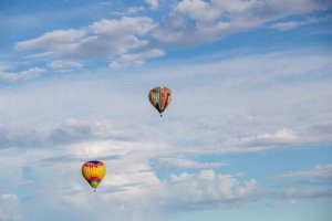 two-hot-air-balloons-flying-in-blue-sky